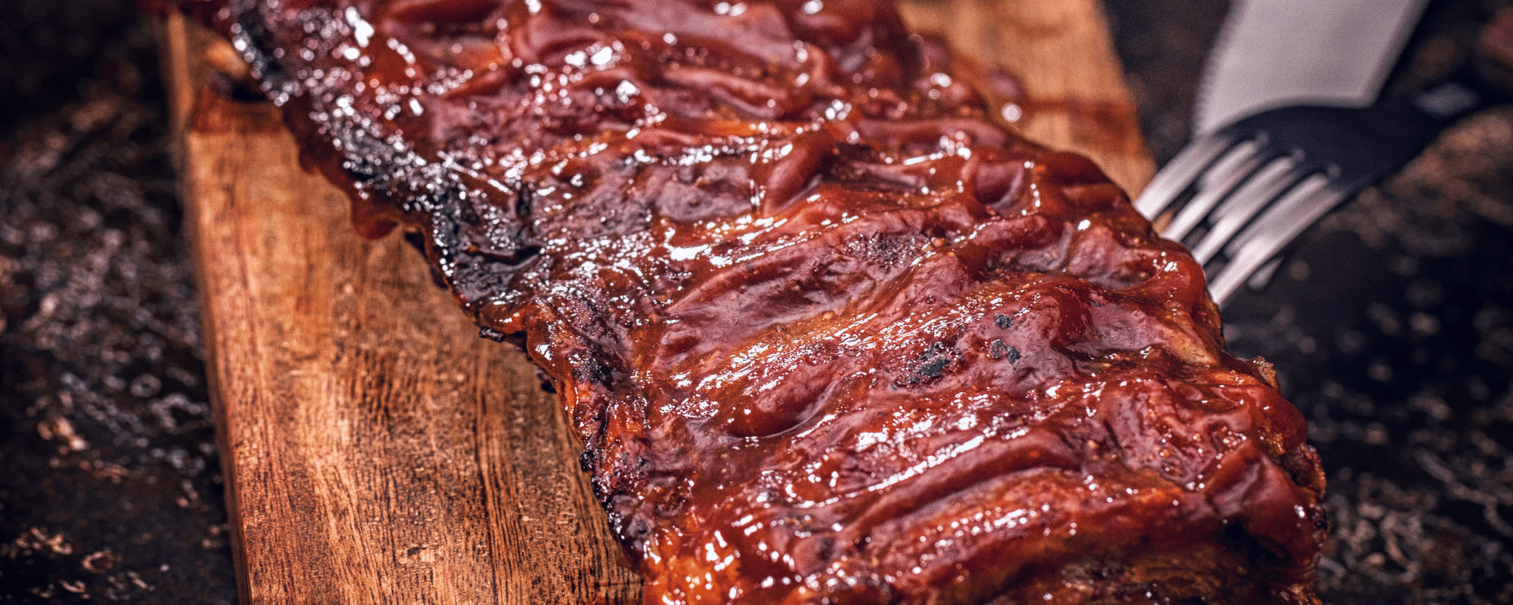 Plate of ribs on a plank of wood