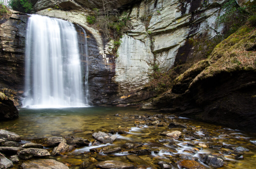 Looking Glass Falls at Pisgah National Forest in Brevard, NC. Read our blog on Looking Glass Falls to learn more about this special waterfall!