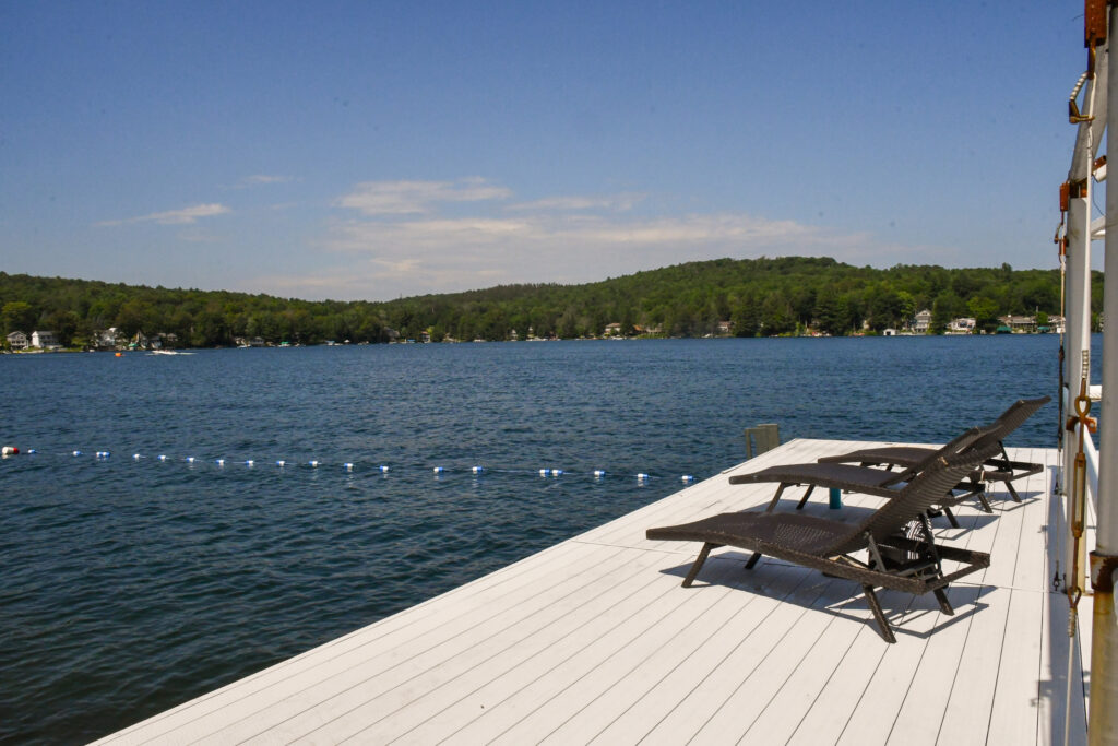 image of lounge chairs on a dock by the lake