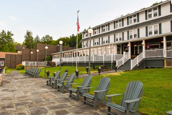 exterior view of the inn with Adirondack chairs