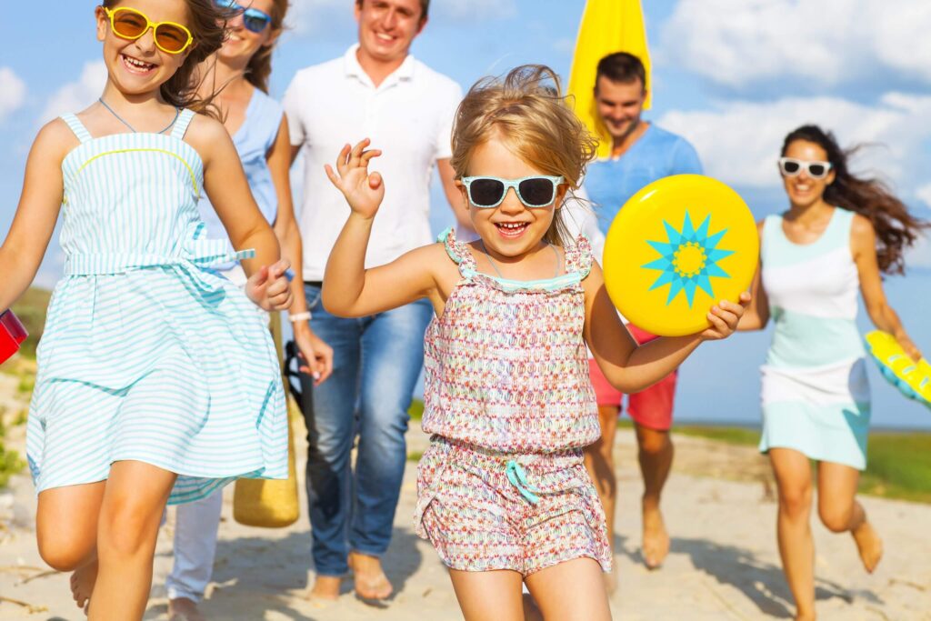 Multiracial group of friends walking at the beach