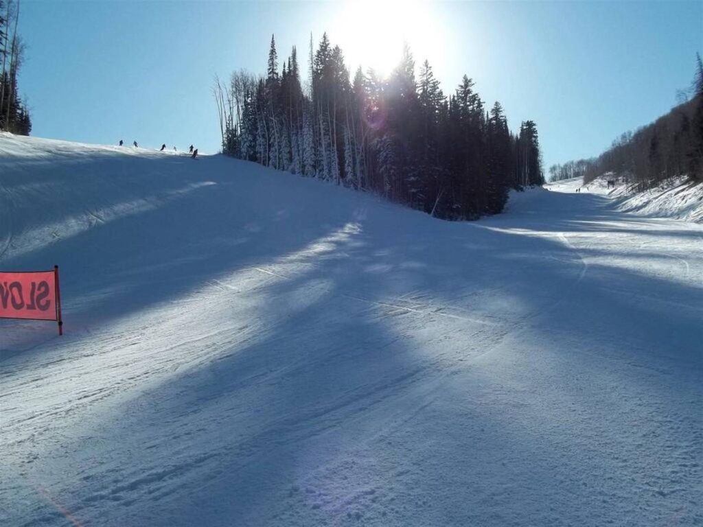 Fresh snow on mountainside ski run