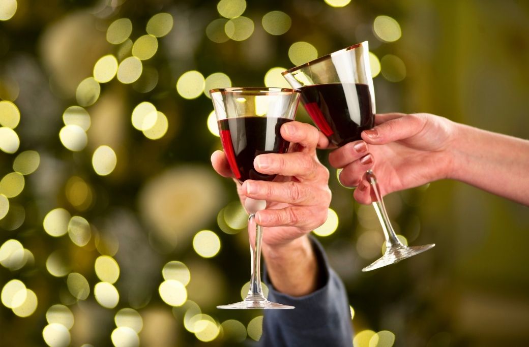 wine toast with christmas lights