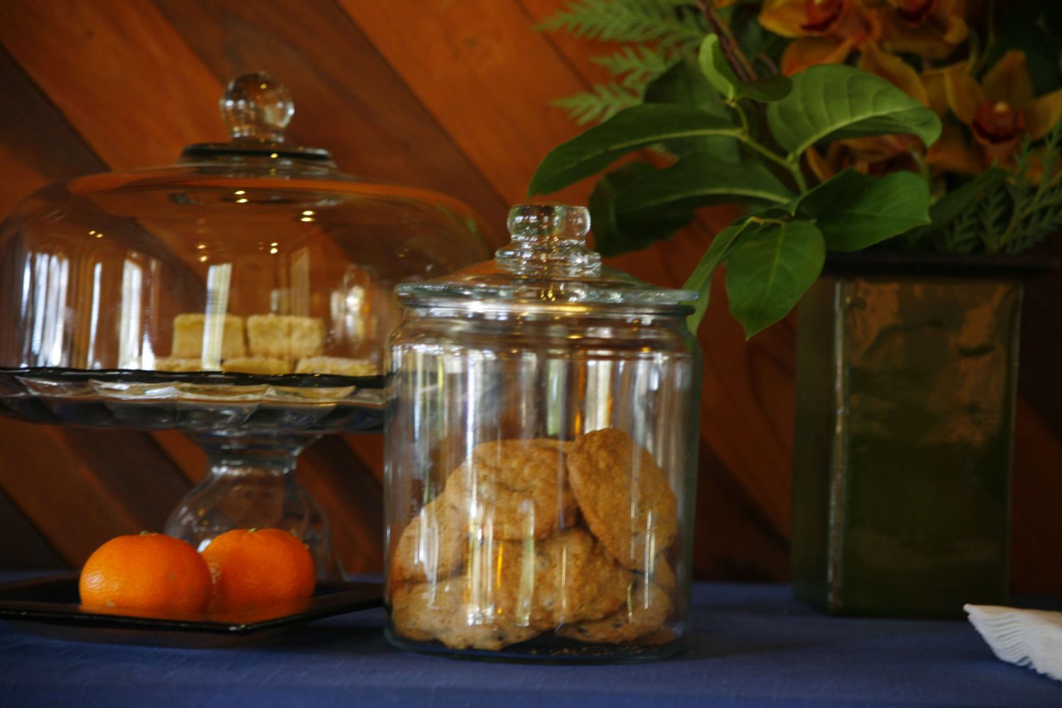 Cookie jar and tangerines on table