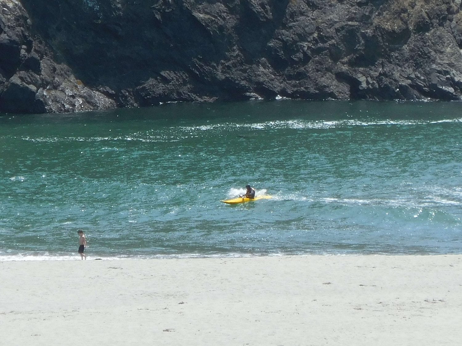 Kayaker Surfing Big River Beach