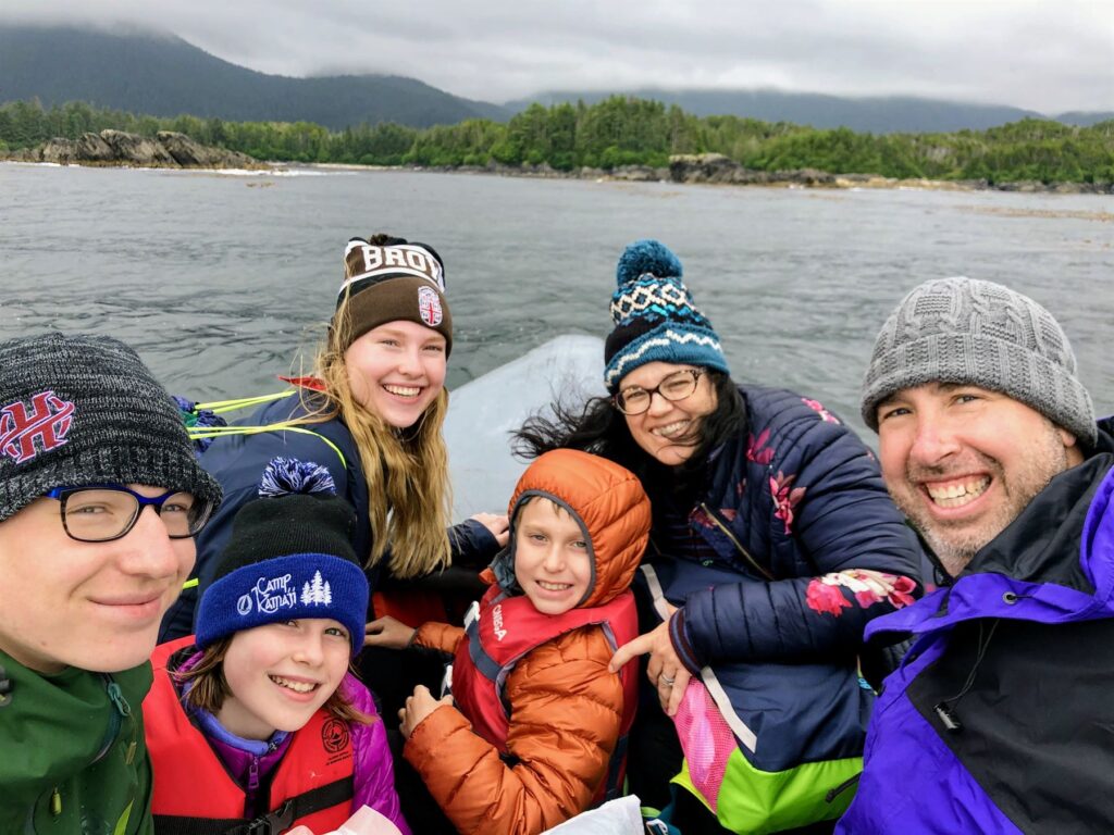 The whole family enjoying a boat ride just off the Alaskan coastline