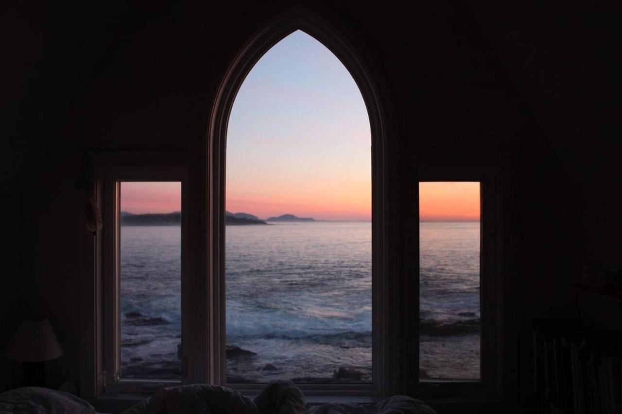 Great Duck Island House | Interior | Sunset through the arched window