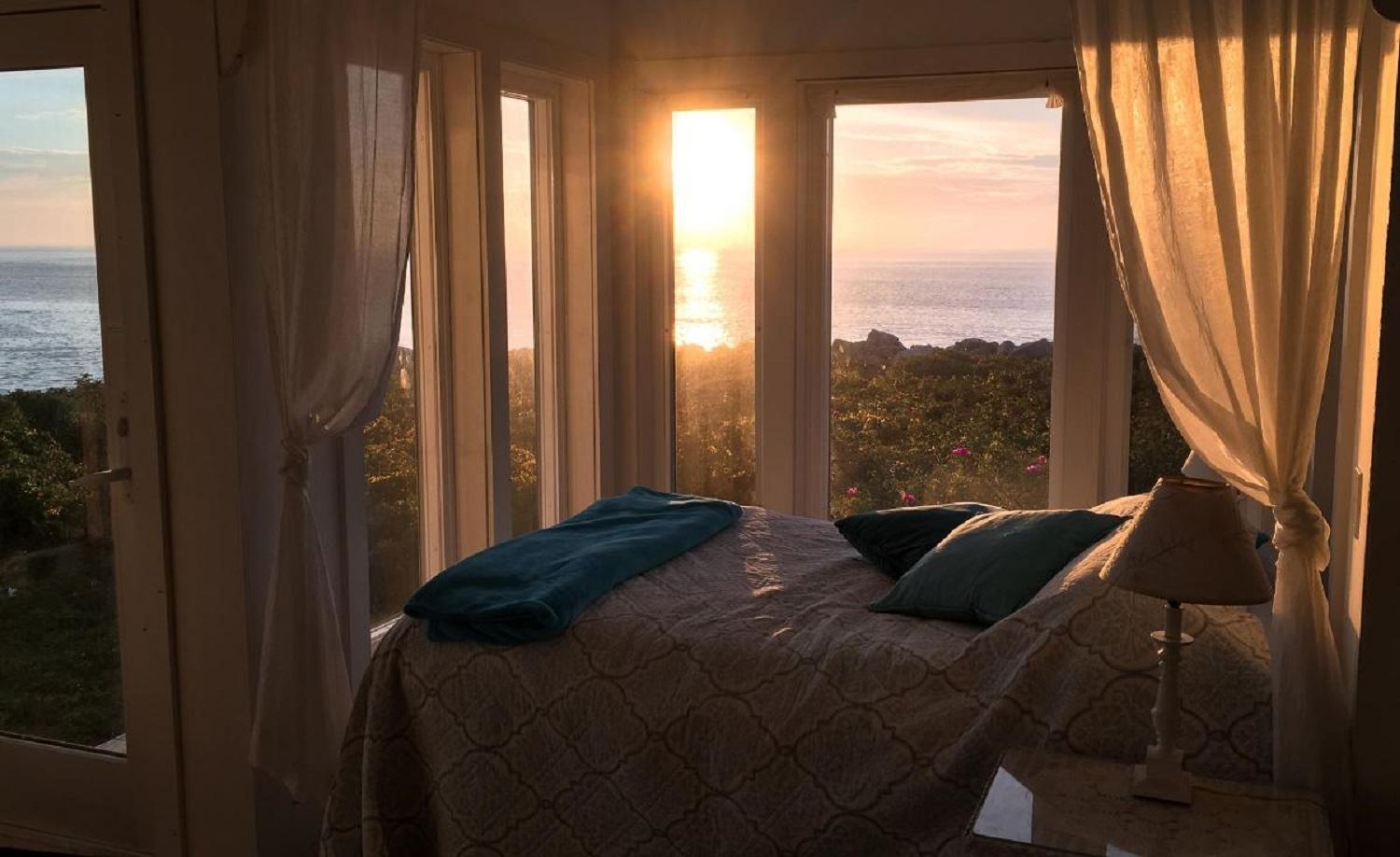 Great Duck Island House | Interior | Bed at sunset