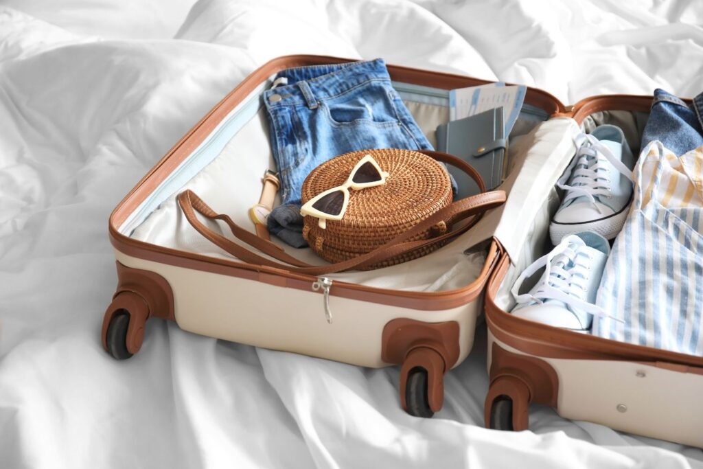Suitcase on a bed.
