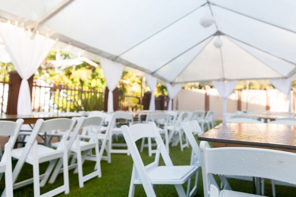 Outdoor wedding venue with tables and chairs