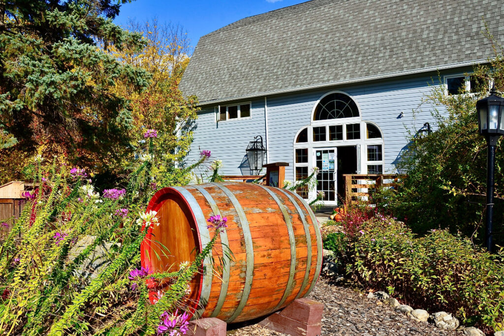 Wooden wine barrel displayed in front of the winery