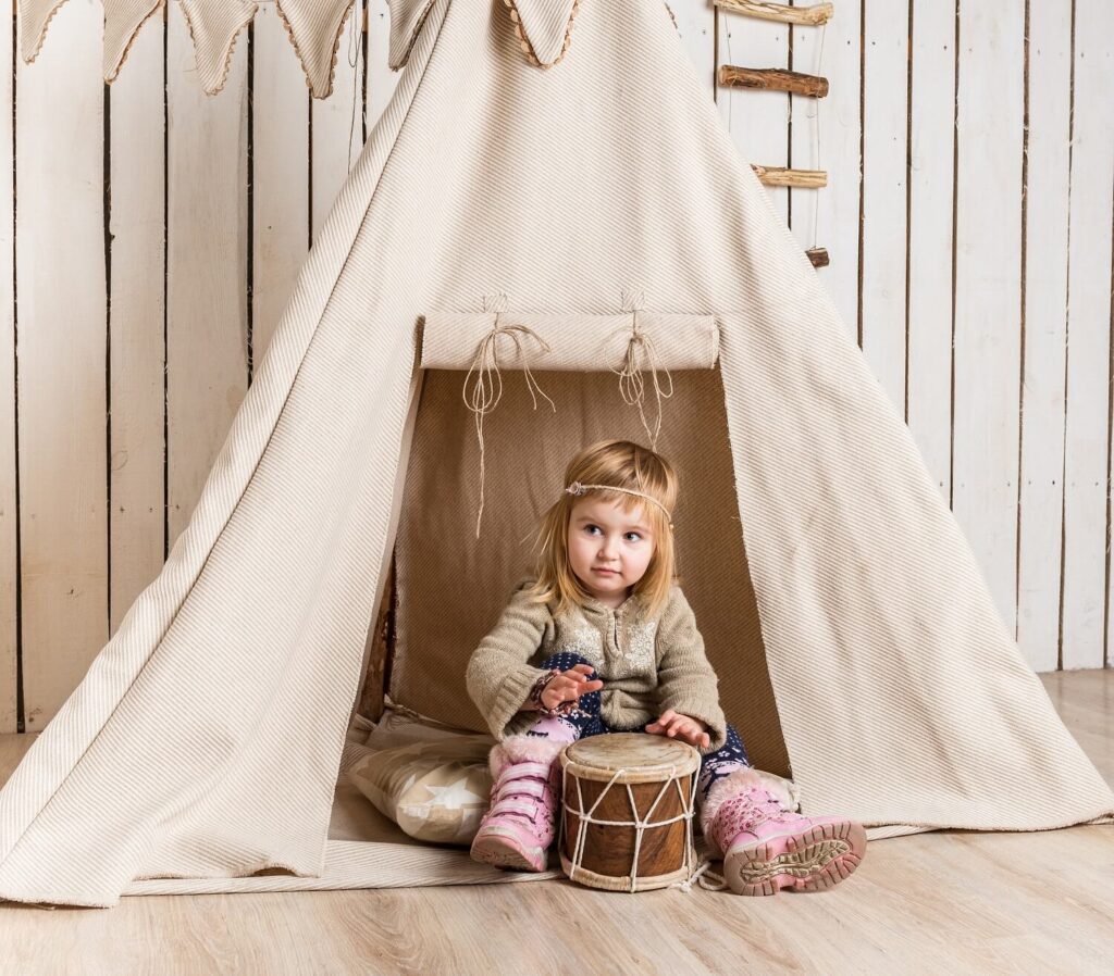 young girl in a tent