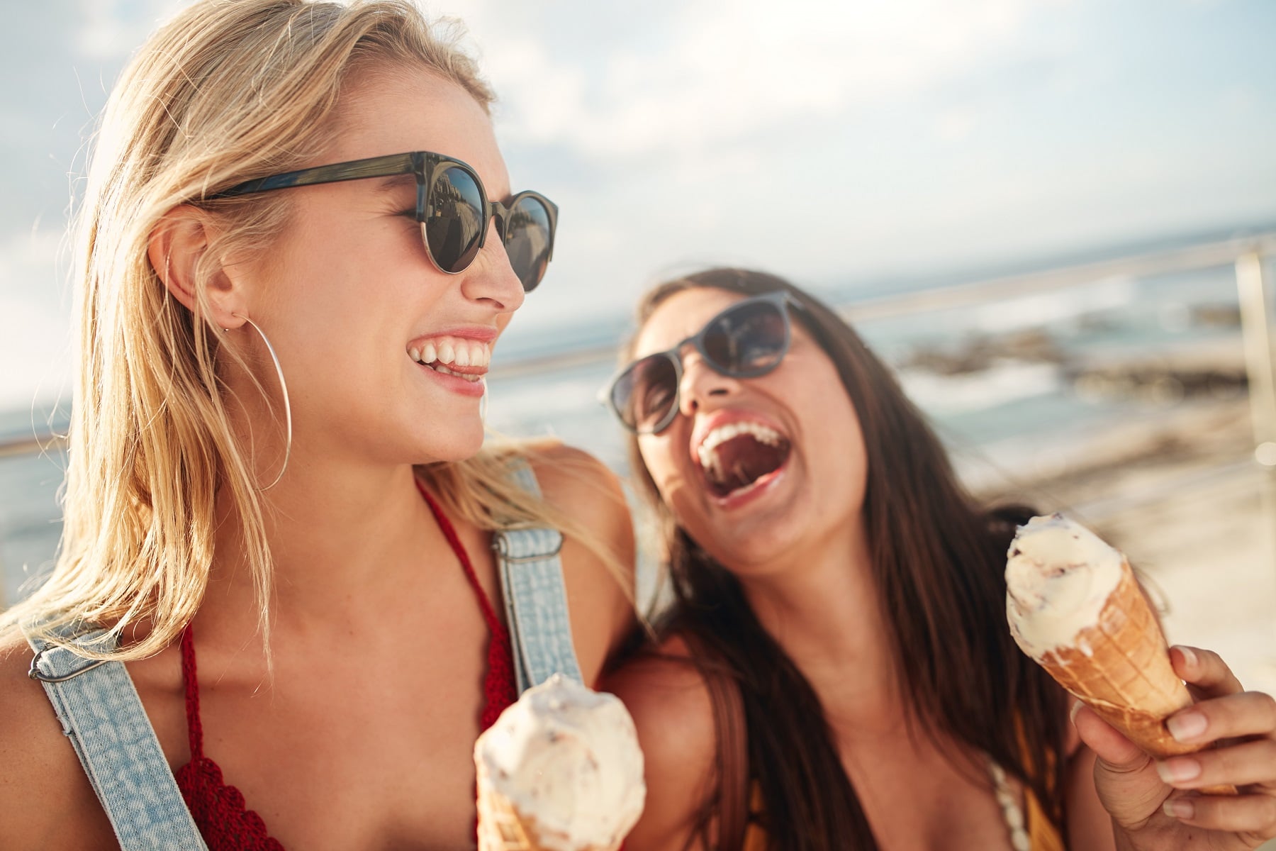 Best friends together outdoors with ice cream