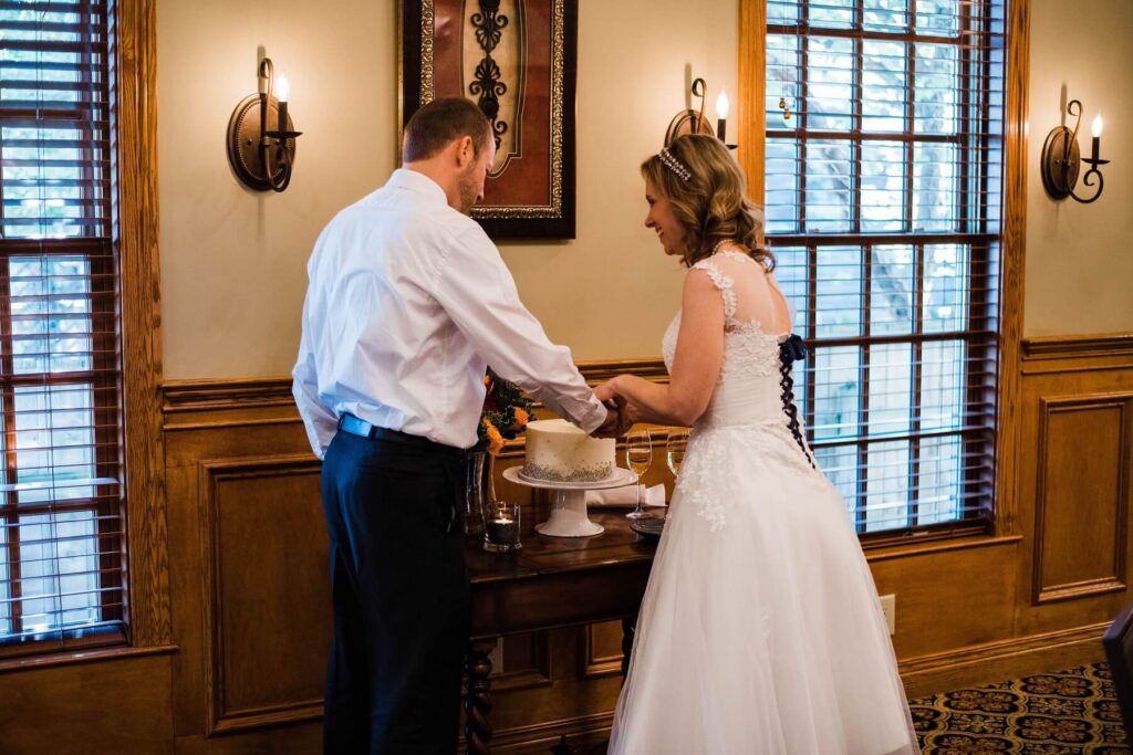 Wedding Couple Cutting Cake at the Brick Street Inn