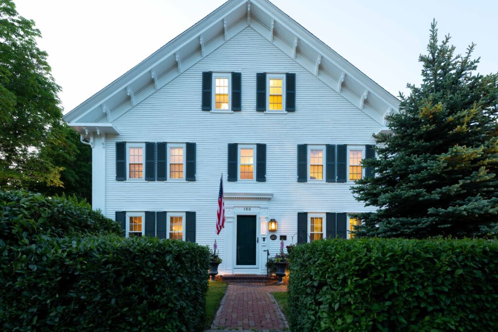 The front of The Inn at Yarmouth Port at twilight