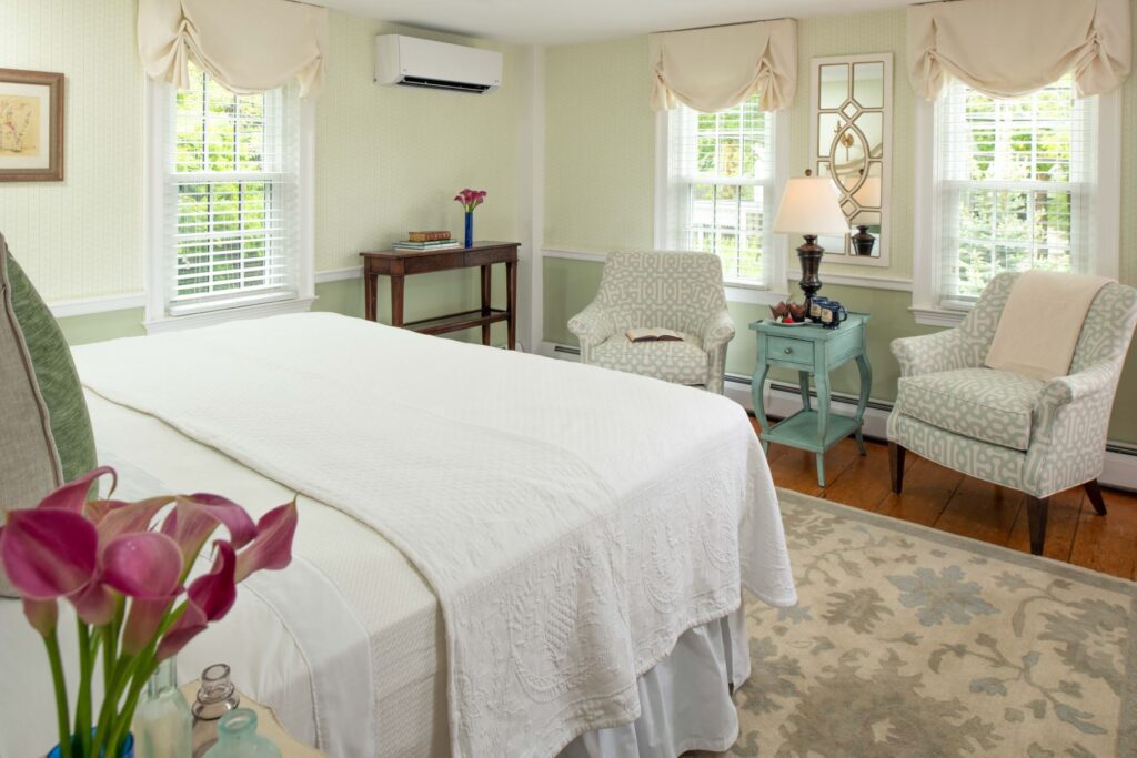 another view of The Cotuit Room at The Inn at Yarmouth Port including bed and seating area