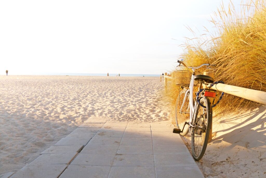 bike setting on a rail next to amelia island beach