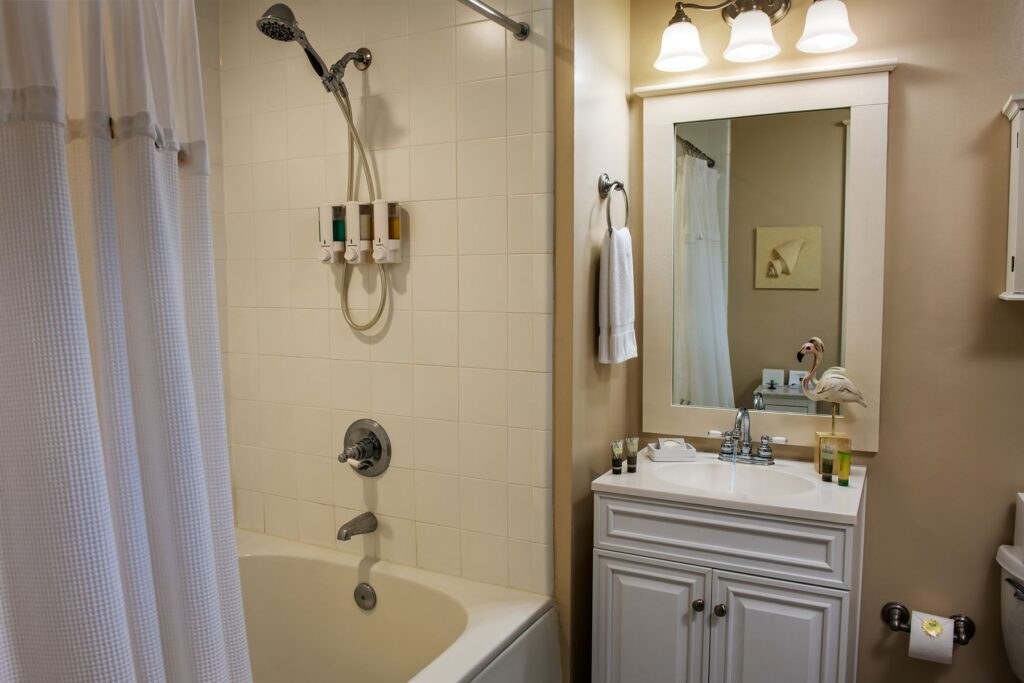 Room 7 at The Addison on Amelia Island - bathroom with shower and bathtub combo