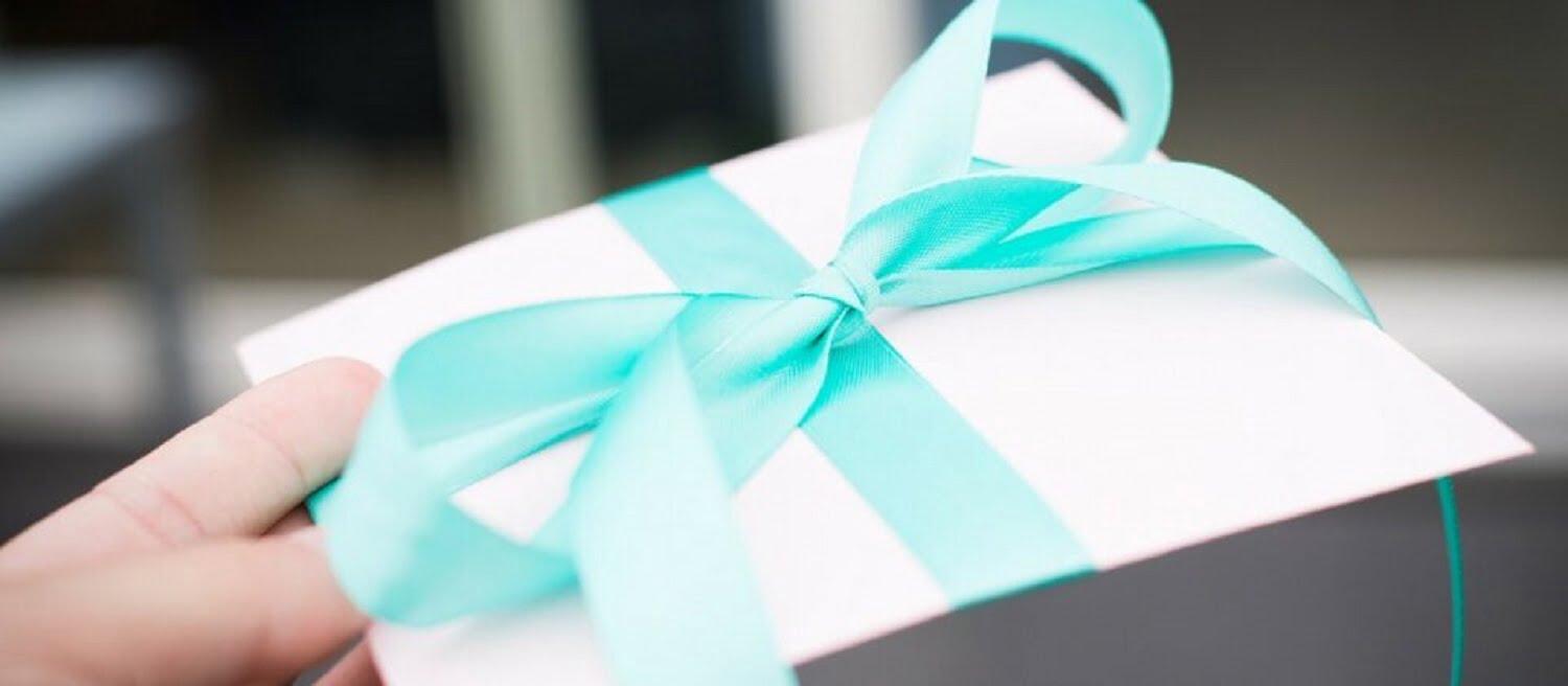 Beautifully wrapped gift in envelope