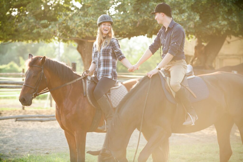 Couple riding horses.