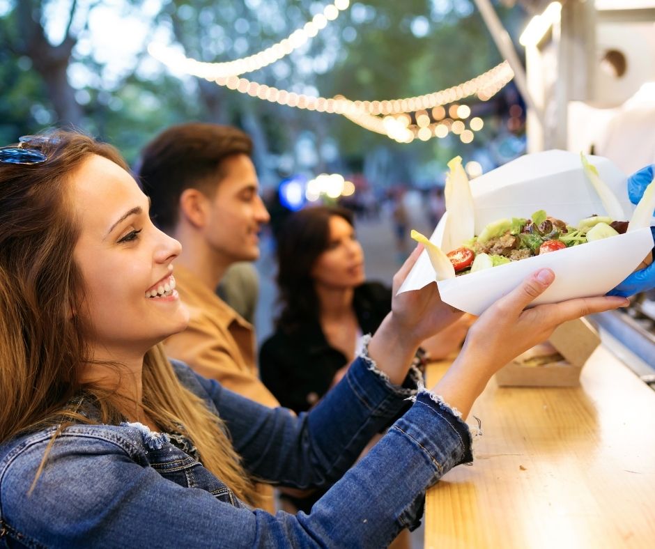 Woman getting food at a food truck