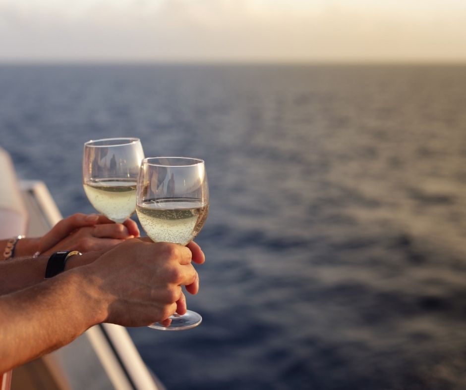 People drinking wine on a sunset cruise