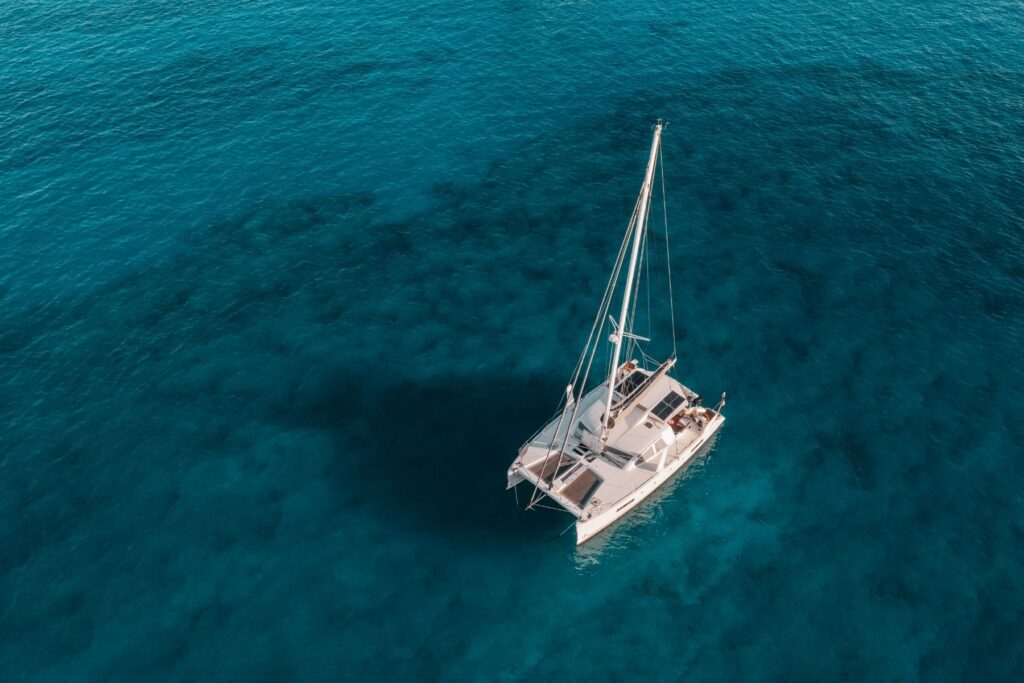 catamaran boat in the middle of the ocean