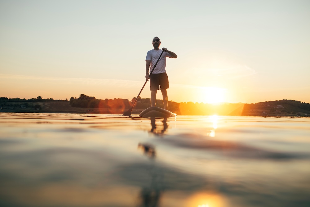 stand up paddle boarding on the coast