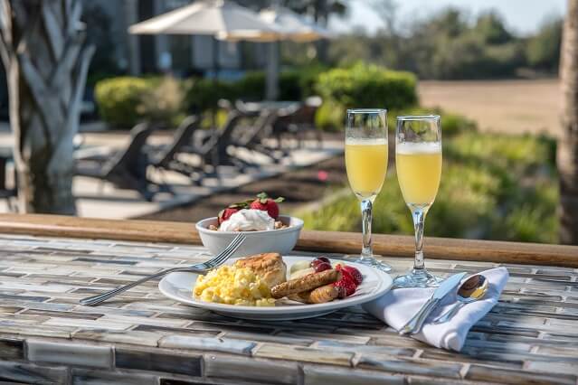 Breakfast plate sitting on outdoor bar top