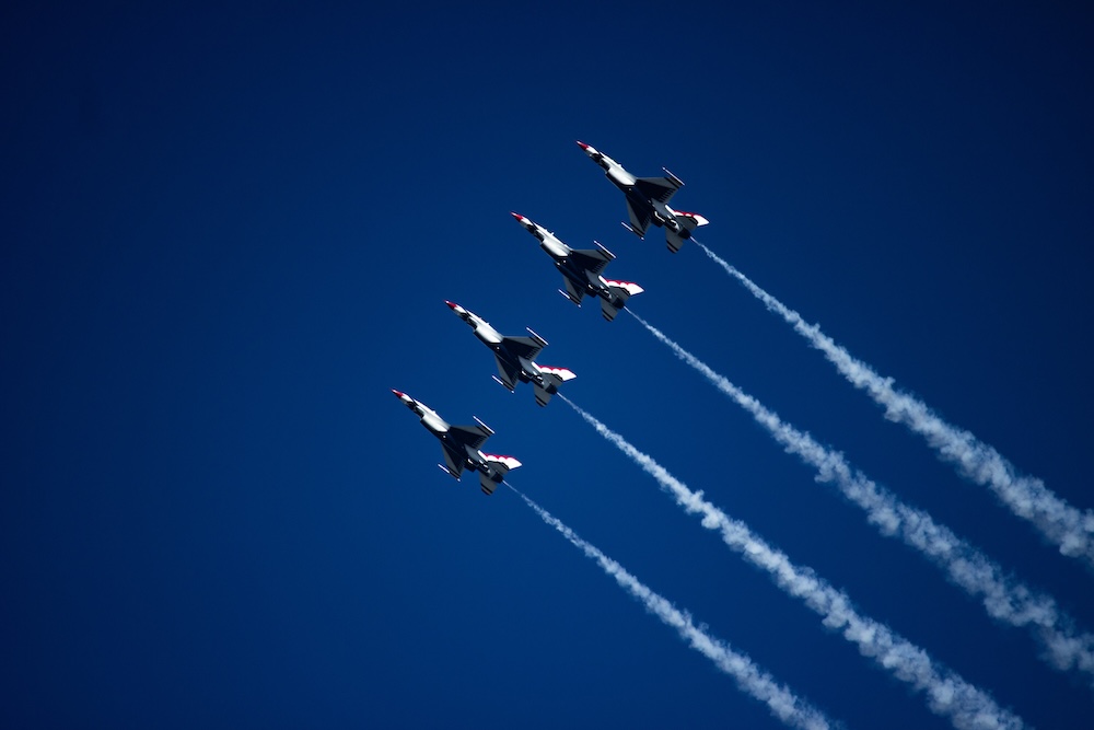 f 16 fighter jets flying above the sky