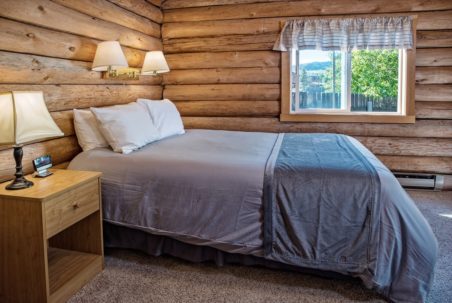 a bed in a Triangle C Cabin rental