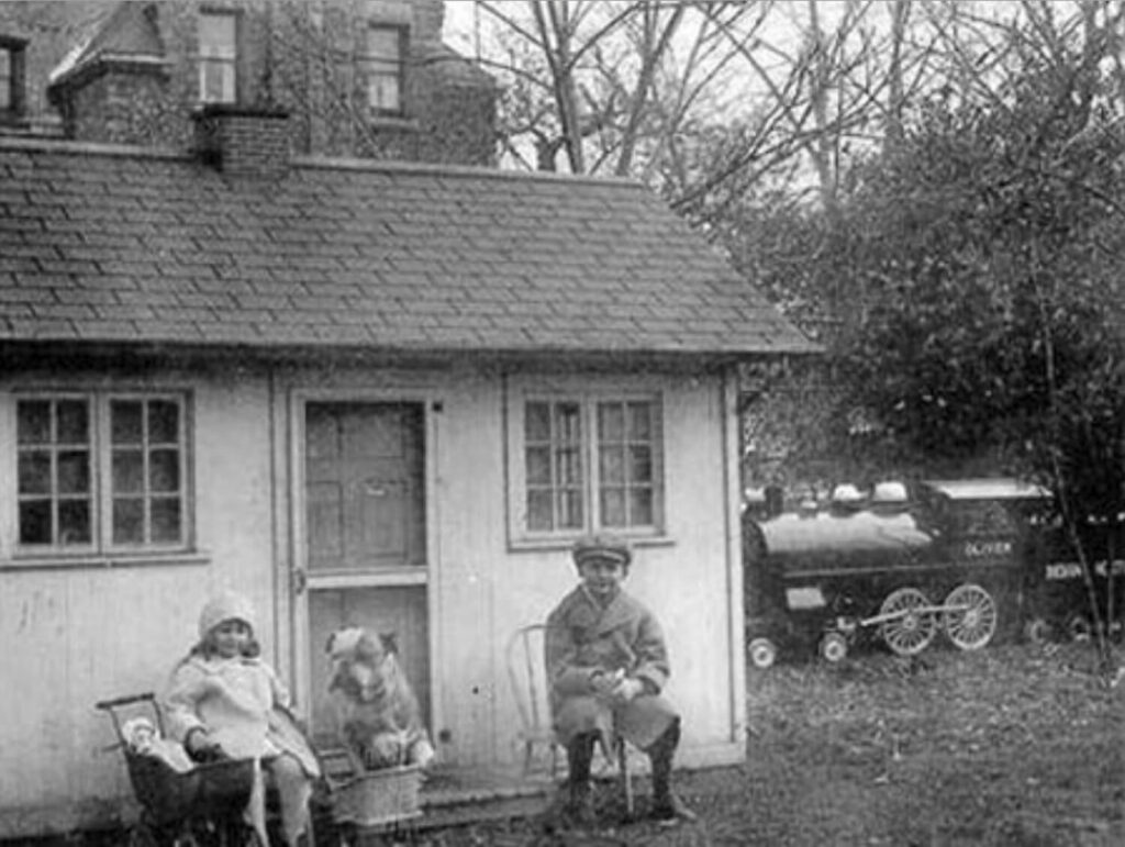 Historical Photo of Playhouse with kids and dog