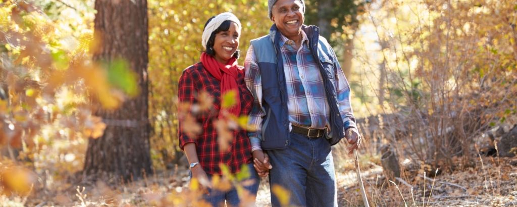 couple in warm clothes hiking during fall