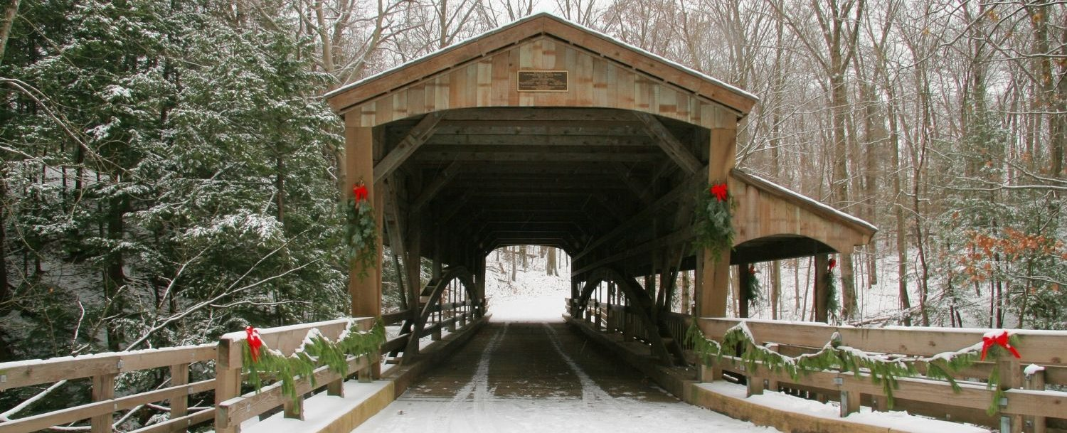Covered Bridge decorated for Christmas and covered in snow