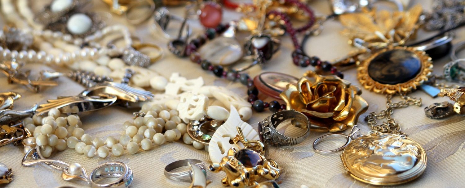 Vintage jewelry laying on a table