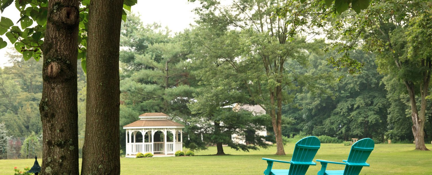 White Oak Inn grounds and gazebo with chairs in foreground