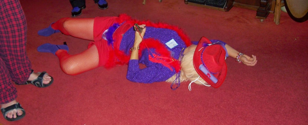 Picture of person in costume laying on floor