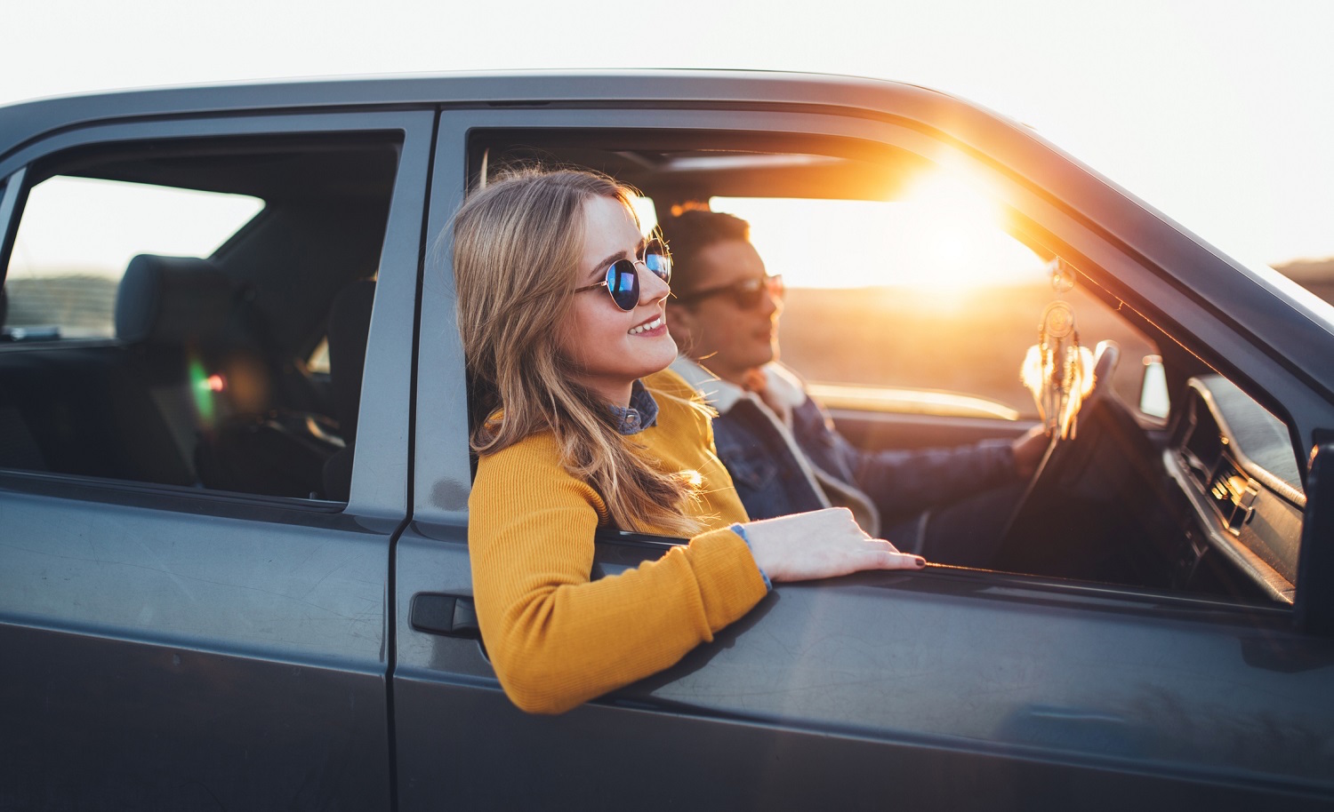 Young hipster couple enjoy sunset roadtrip