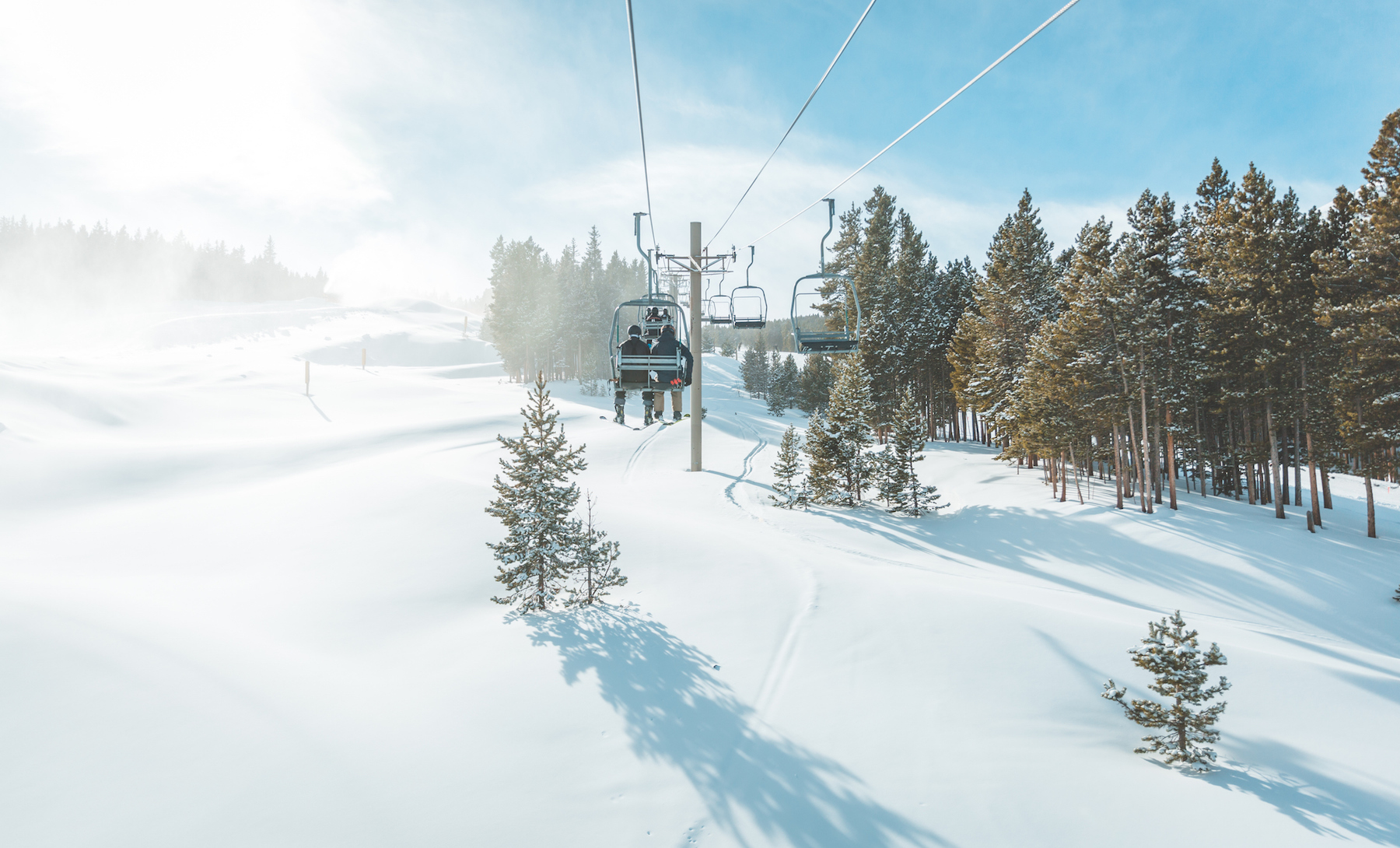 People on ski lift at ski resort in the winter