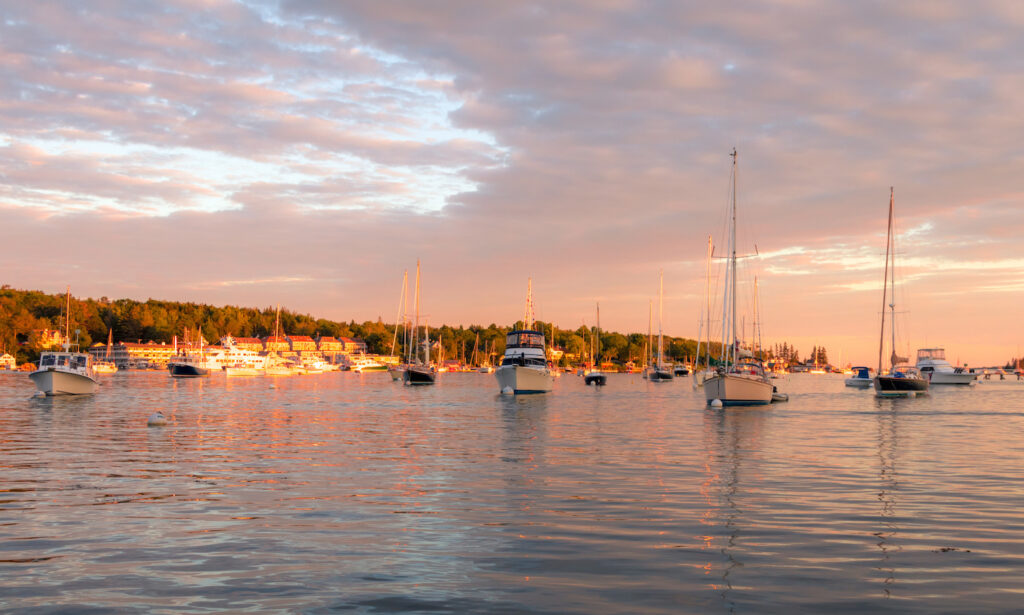 Boats in the calm and beautiful Boothbay Harbor in Maine at dusk