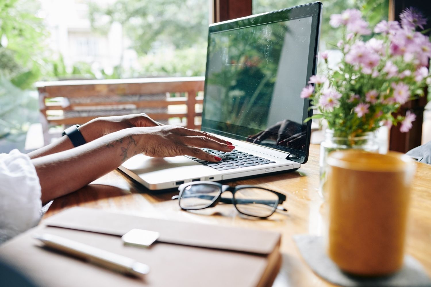 Lady working from a desk outside