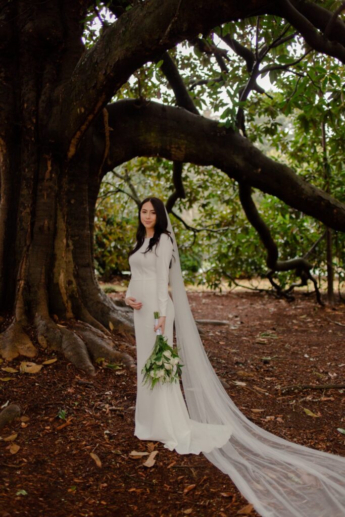 Bride Under Oak Tree in Wedding Dress