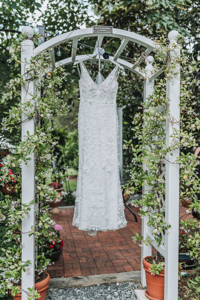 Wedding Dress Hanging From Arch