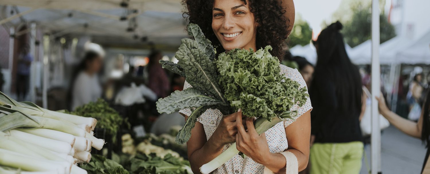 Farmers Market Woman Holding Kale