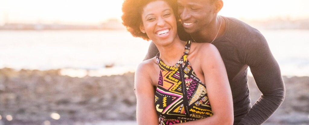 African America couple in a candid shot on the beach
