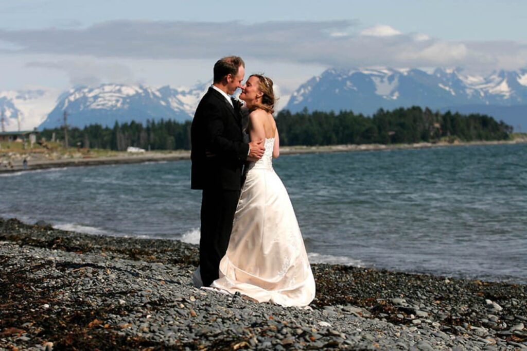 Bride and Groom kissing on beach