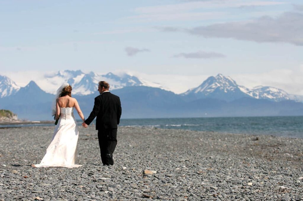 Bride and Groom walkin on beach