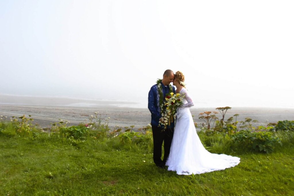 bride and groom on bluff