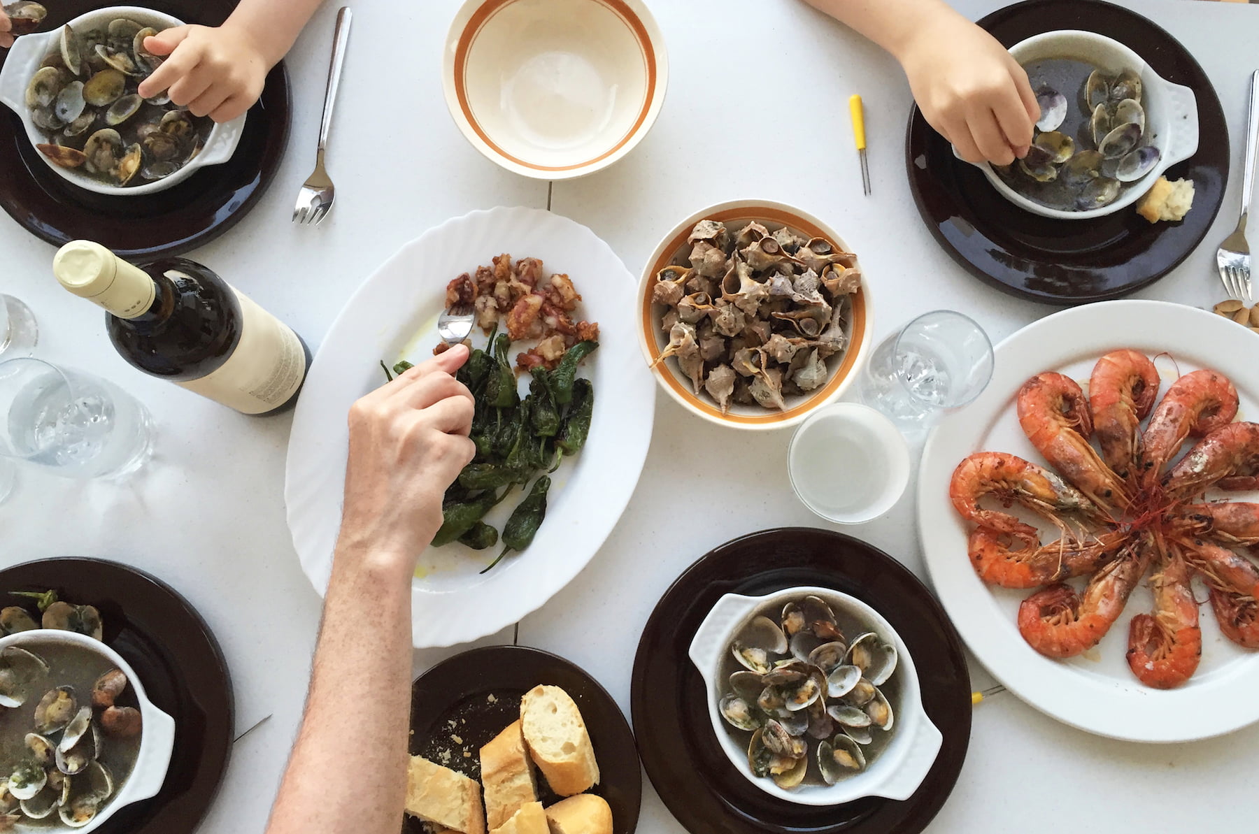 People sharing a seafood platter.