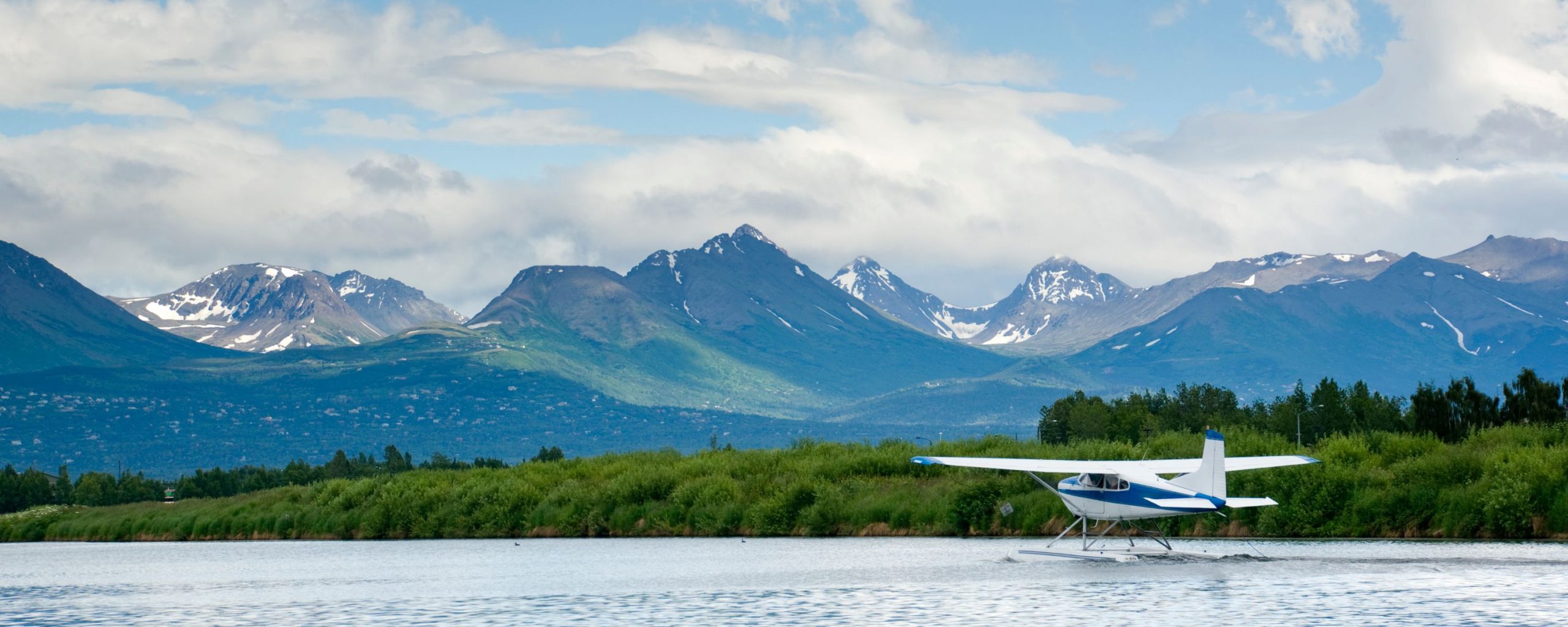 A plane taking off from the water in Alaska